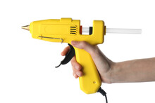 Woman Holding Yellow Glue Gun With Stick On White Background, Closeup