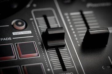 DJ tempo fader on a Digital DJ controller closed up shot.