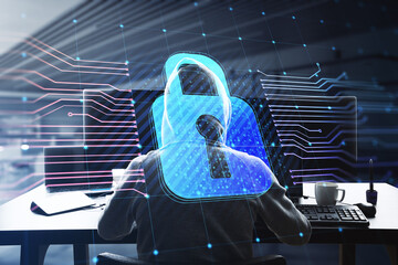 Poster - Back view of hacker at desktop using computers with glowing padlock hologram and lines on blurry office interior background. Secure, hacking, safety and protection concept. Double exposure.