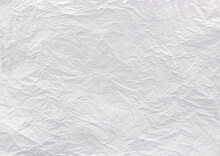 Closeup To White Crumpled Paper Texture Background