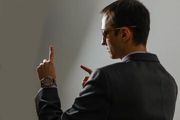 Poster - Businessman click on virtual touchscreen. Futuristic business and IT presentation background