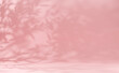 Premium abstract light pink wall summer background with leaves shadow