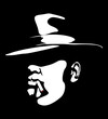 Chicago and Britain gangster mafia. Mysterious silhouette face of a man in a hat who smokes a cigar. Portrait for poster idea. Italian mafia.