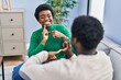 © Krakenimages.com - African american man and woman couple speaking with deaf language at home