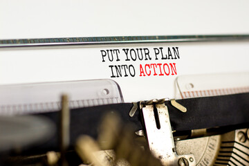 Wall Mural - Put your plan into action symbol. Concept words Put your plan into action typed on old retro typewriter. Beautiful white background. Business planning put your plan into action concept. Copy space.
