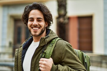 Sticker - Handsome hispanic man smiling at the city