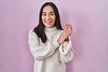 Sticker - Young south asian woman standing over pink background clapping and applauding happy and joyful, smiling proud hands together