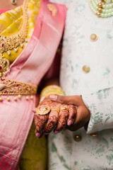 Wall Mural - Indian bride and groom holding hands