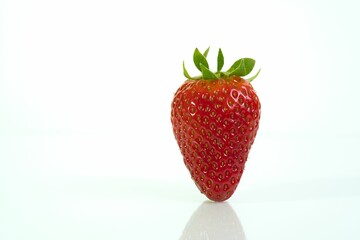 Poster - one strawberry isolated on white background.