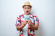 © Reza - Young Asian man showing excited face expression while holding money