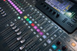 © stas_malyarevsky - Professional audio mixing console. ​Mixer. Pro audio mixing board faders and knobs. Static shot of multi-track music recording equipment faders and sliders.