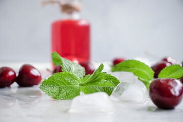 Wall Mural - Cherry juice, fresh berry on a light background