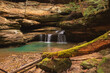 Pristine waterfall flowing through stone cliffs in Hocking Hills State Park, Ohio. 