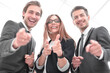 © ASDF - A group of business people standing and pointing at you