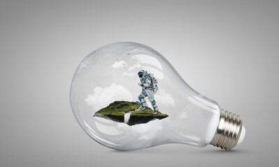Wall Mural - spaceman inside light bulb . mixed media