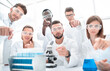 © ASDF - group of lab teachnican working in a modern laboratory