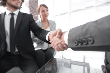 Wall Mural - Closeup of a business hand shake