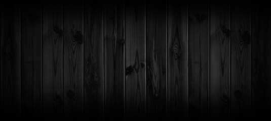 Black wood texture background coming from natural tree. The wooden panel has a beautiful dark pattern, hardwood floor texture