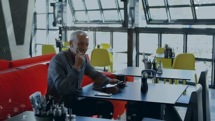 Poster - Animation of data processing over caucasian businessman talking on smartphone
