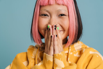 Wall Mural - Asian girl with pink hair laughing and covering her mouth