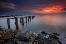 Beautiful Dramatic Sunset At Pantai Robina,Teluk Air Tawar Penang, Malaysia. Soft Focus Due To Long Exposure.