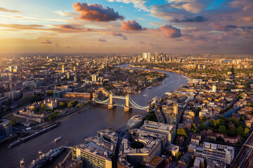 Wall Mural - Beautiful, panoramic sunset view of the skyline of London with Tower Bridge along the river Thames until Canary Wharf, England