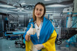 Pretty female surgeon or nurse in the Ukrainian flag during the war with Russia
