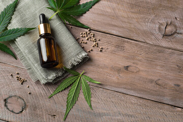 Wall Mural - Face serum and hemp plant leaves