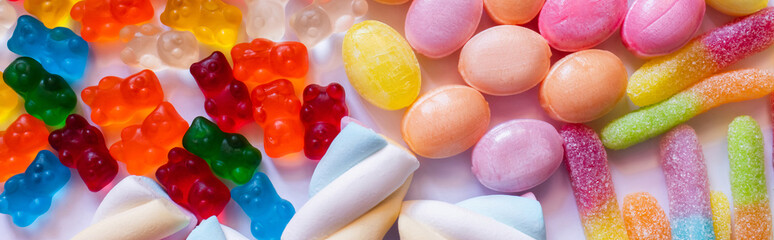 Wall Mural - Top view of jelly bears near sweets on white background, banner.