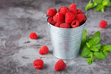 Wall Mural - Raspberries in the small bucket