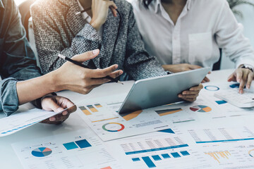 A group of business people working together on a new project to analyze budgets and manage investment risks in today's profit boosting for marketing in the conference room