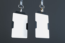 Blank White Plastic Name Tags With Space For Your Logo Or Text With Grey Neck Straps Isolated On Dark Background. 3D Rendering, Mock Up