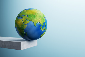 Poster - Abstract image of globe on edge of concrete block trampoline and mock up place on blue background. 3D Rendering.