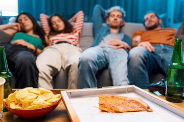 Wall Mural - Friends sleeping on the couch after eating pizza
