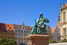 Old Statue Of The Polish Poet, Playwright And Comedy Writer Aleksander Fredro On The Market Square In Front Of The Town Hall Of Wroclaw, Poland