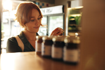 Happy young woman buy groceries in a supermarket