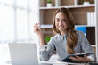 © PaeGAG - Portrait of businesswoman working with computer laptop on the table in modern meeting room.