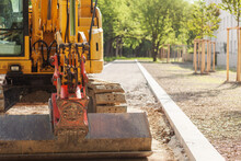 Excavator Lying New Road, Walkway Or Pathway, Doing Landscaping Works.
