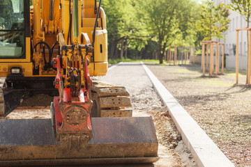 Excavator Lying new Road, Walkway or Pathway, doing landscaping works.