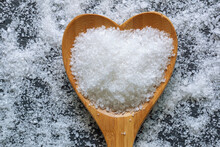 Natural Cooking Salt In Heart Shaped Spoon. Flat Lay