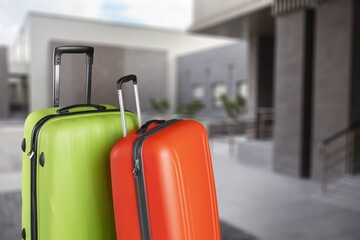 Wall Mural - Travel Fashion. Plastic Suitcases Standing At Empty Airport Corridor, Stylish Luggage Bags Waiting At Terminal Hall,