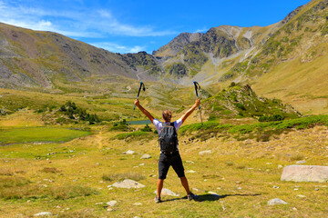 Wall Mural - hiker man and backpack in the Pyrenees mountain- success, travel, sport concept