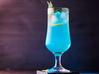 Wall Mural - blue lagoon cocktail on a blue background