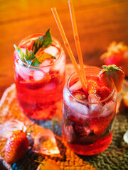 Wall Mural - two glasses of strawberry mojito, refreshing summer cocktail