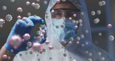 Poster - Covid-19 cells floating over male health worker wearing protective clothes holding a vial bottle