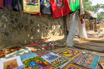 Wall Mural - PINGLA, WEST BENGAL , INDIA - NOVEMBER 16TH 2014 : Colourful handicrafts are being prepared for sale in Pingla village by Indian rural man worker. Handicrafts are rural Industry in West Bengal.