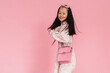 © Drobot Dean - Asian preteen girl wearing dress smiling while looking at camera