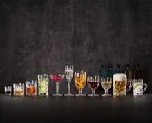 Row Of Various Alcoholic Drinks In Crystal Glasses