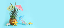 Image With Ripe Pineapple With Parasol And Beach Chair Over Blue Background. Summer Holidays And Tropical Theme