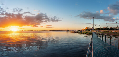 Poster - Panoramic view of Sunset at Guaiba River with Gasometro Power Plant (Usina do Gasometro) and Moacyr Scliar Park and - Revitalized Orla do Guaiba Waterfront - Porto Alegre, Rio Grande do Sul, Brazil